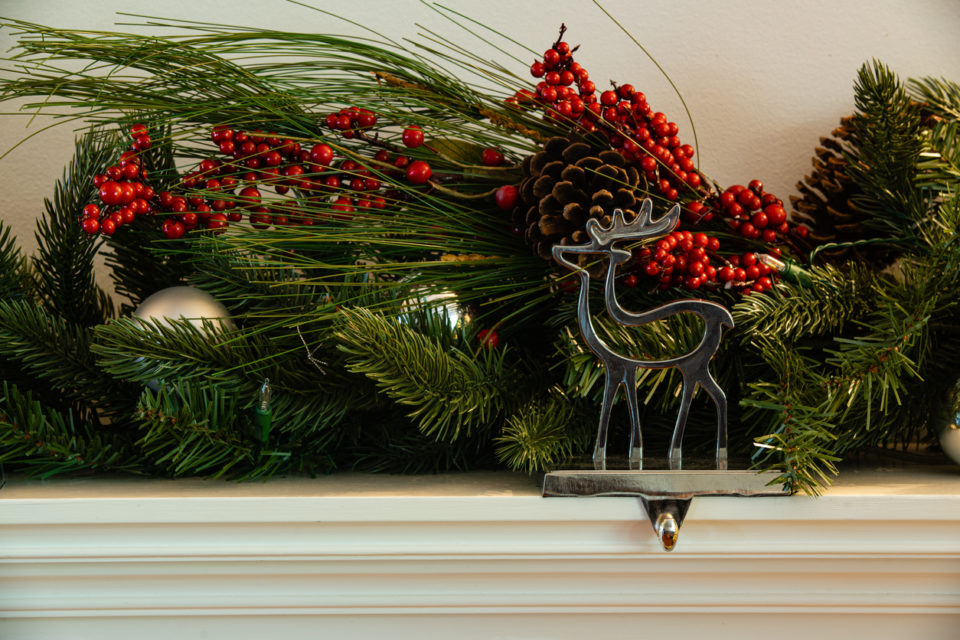 Christmas fireplace hanger reindeer with green garland cherry and bauballs