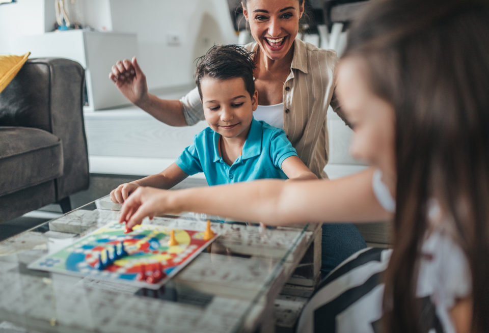 Family playing board game at home