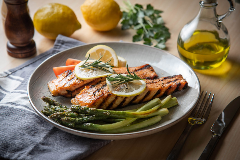 grilled salmon fillet on plate with asparagus