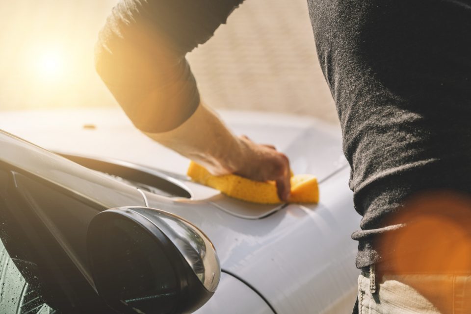 Man holding sponge for car wash