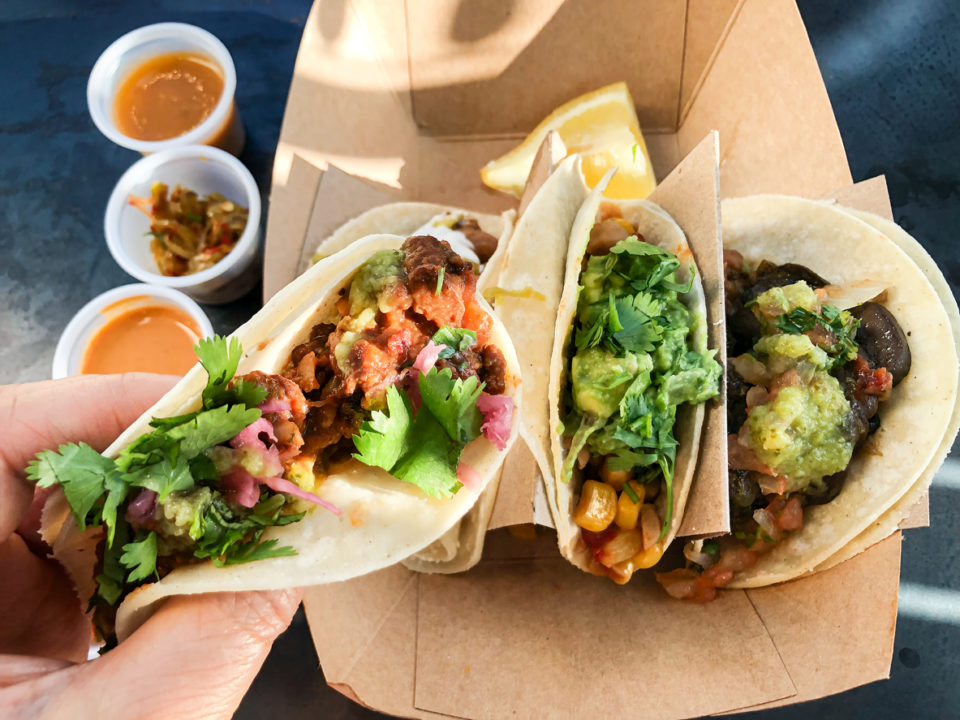 Three tacos in a delivery container