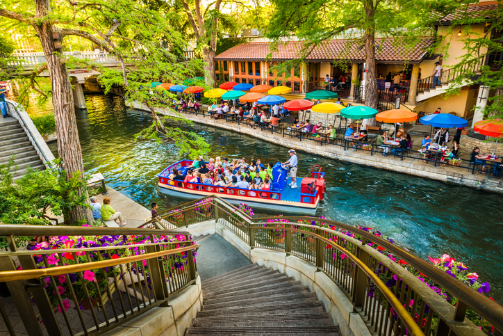 The riverwalk in San Antonio park walkway scenic canal tour boat